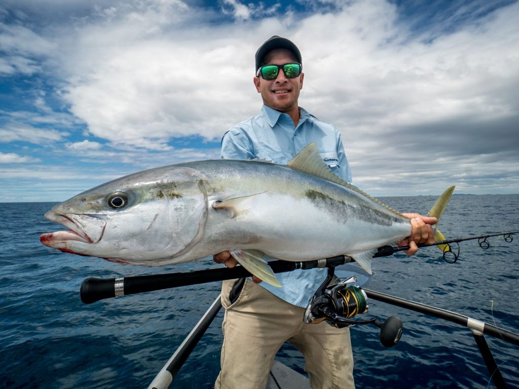 Fishing with Shimano Reel Man holding a fish