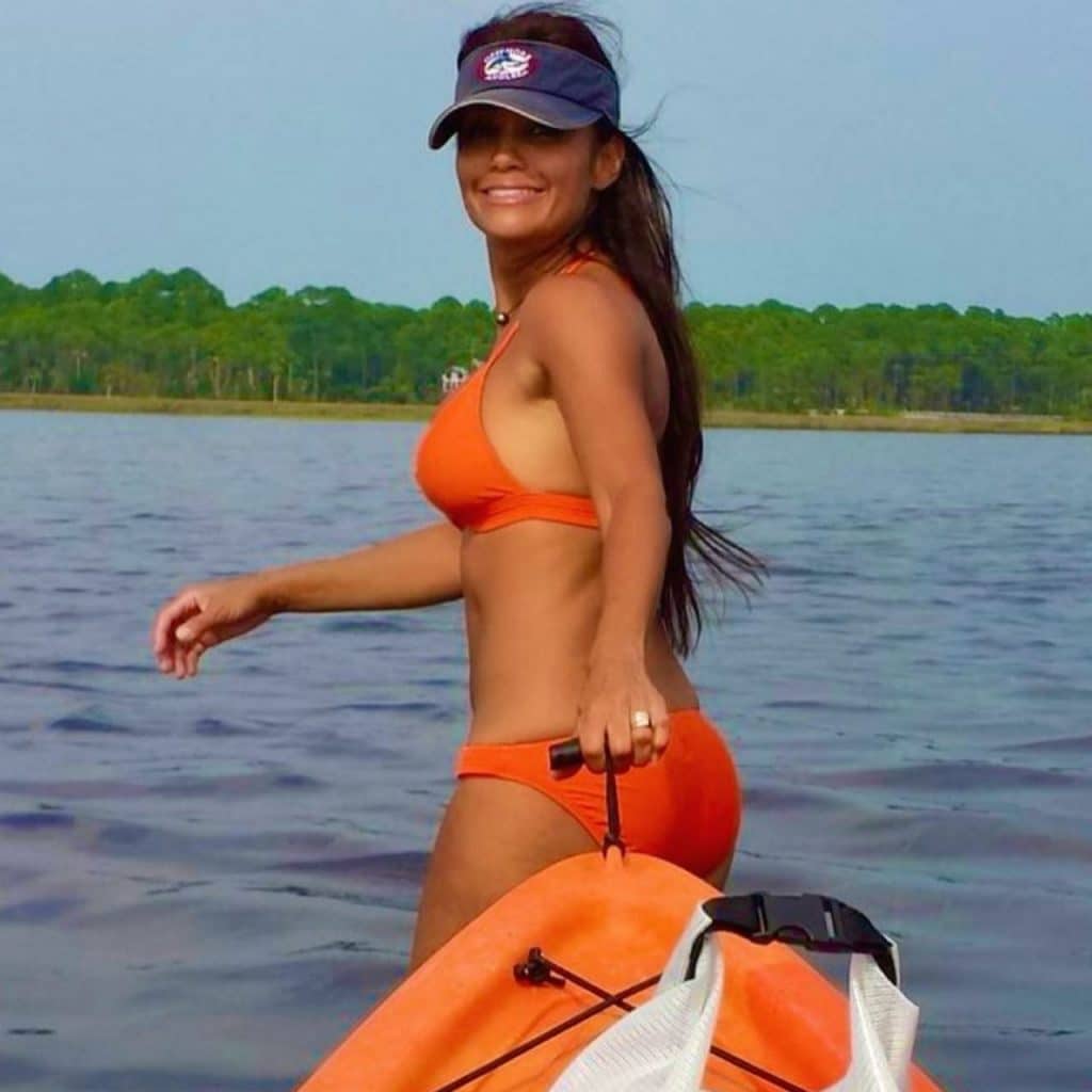 Pulling-a-kyak-in-orange-bikini