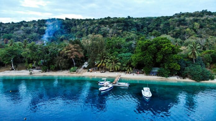 Aerial of Trees and Fishes at Port Havannah with Edgewater sport fishers at the jetty, Vanuatu.