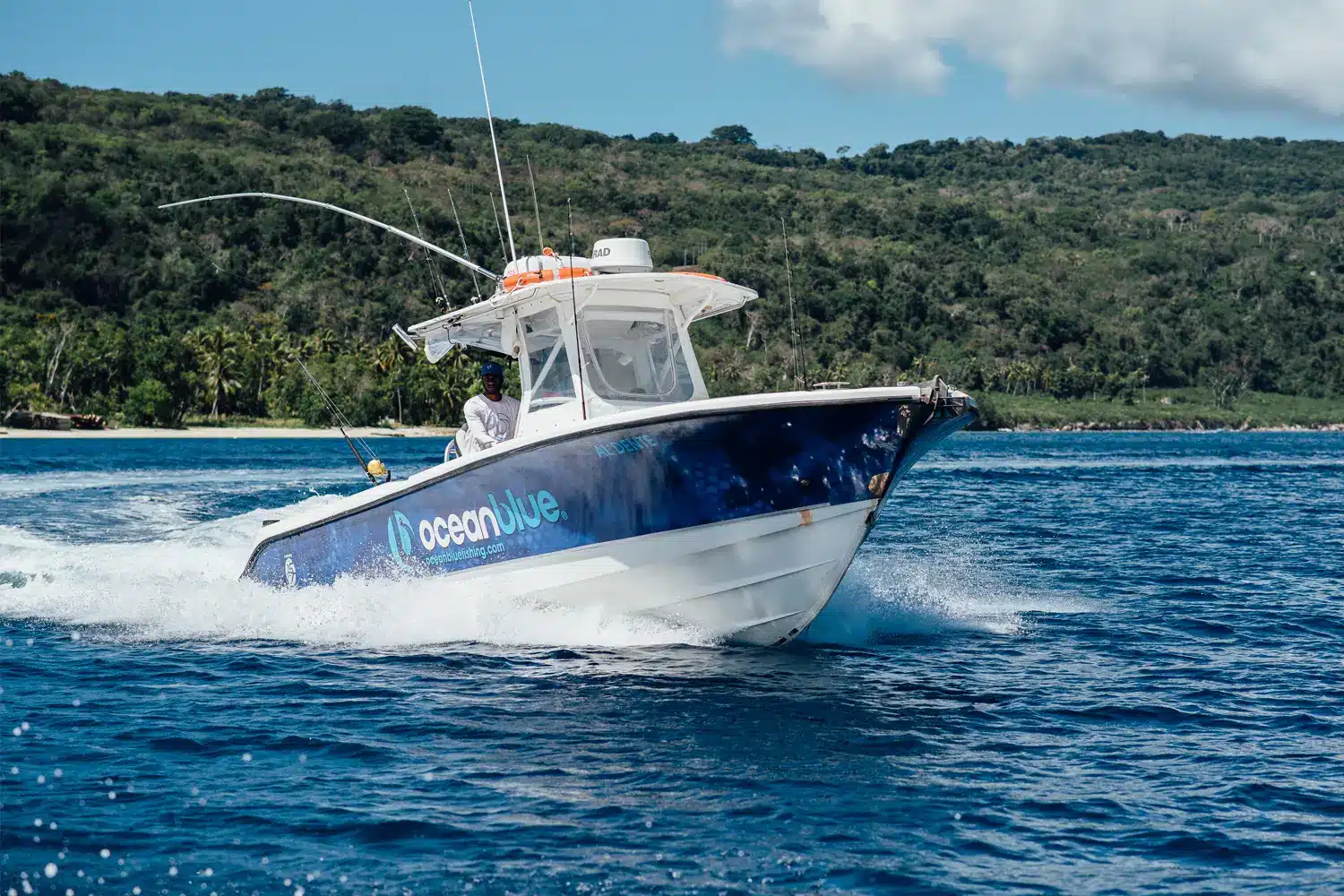 Ocean Blue Fishing boat on the water during a day sportfishing charter in Vanuatu, with anglers ready for adventure